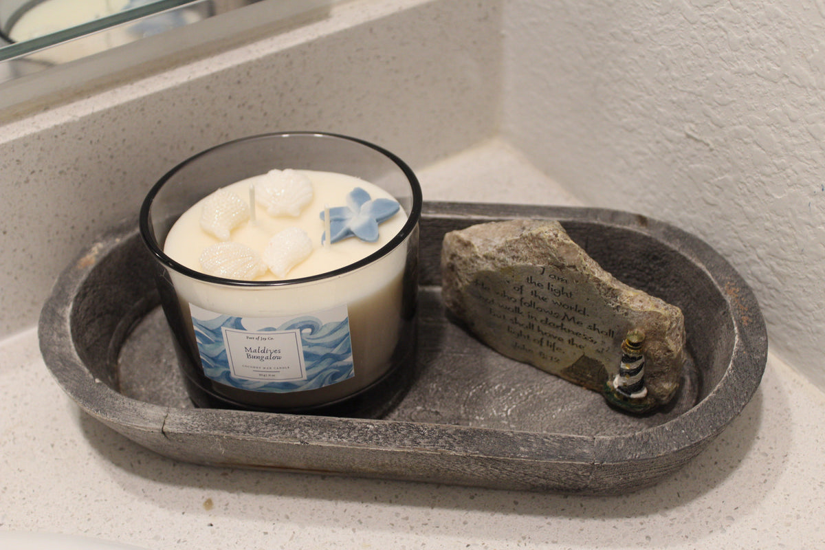 Handmade ocean-inspired candle in a gray big glass jar.