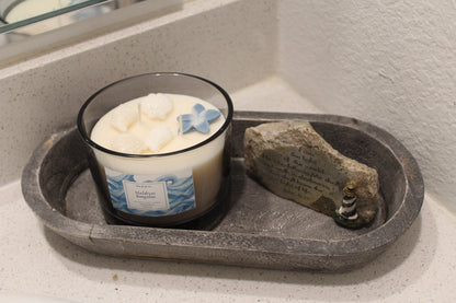 Handmade ocean-inspired candle in a gray big glass jar.