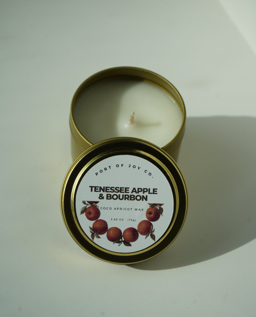 Apple Bourbon 4 oz travel tin candle with warm fall fragrance