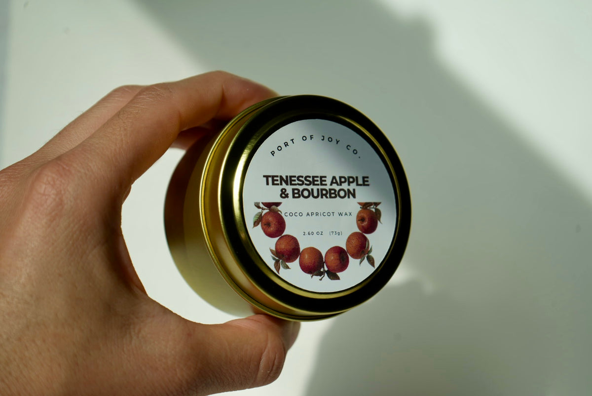 Cozy fall Apple Bourbon scented candle in reusable travel tin