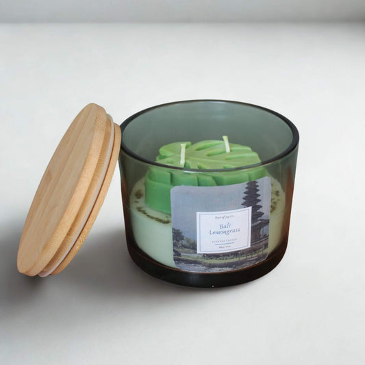 handmade scented bali lemongrass candle with wooden lid open.