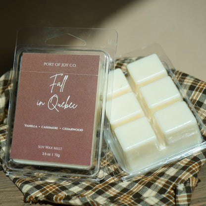 Port of Joy Co. 'Fall in Quebec' soy wax melt in a clear clamshell package, showing the browned label and six white wax cubes 