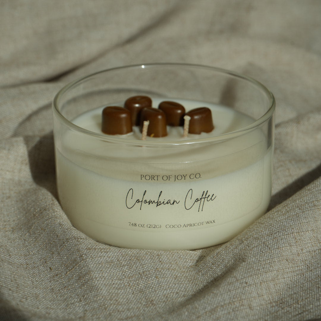 colombian coffee candle in a clear glass jar.