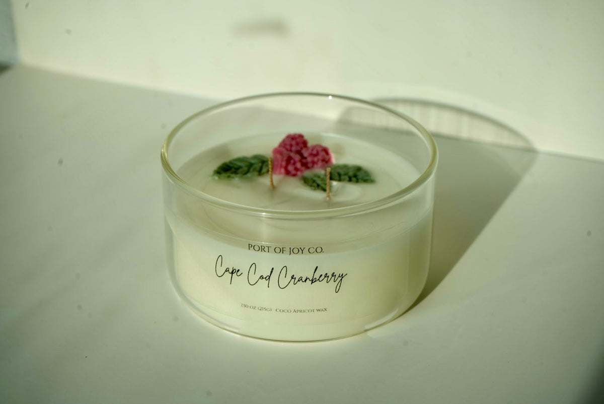 Cozy cranberry scented candle for autumn evenings and holiday decor