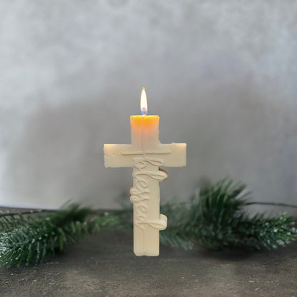 Blessed cross soy pillar candle displayed as a baptism gift and Christian decor piece