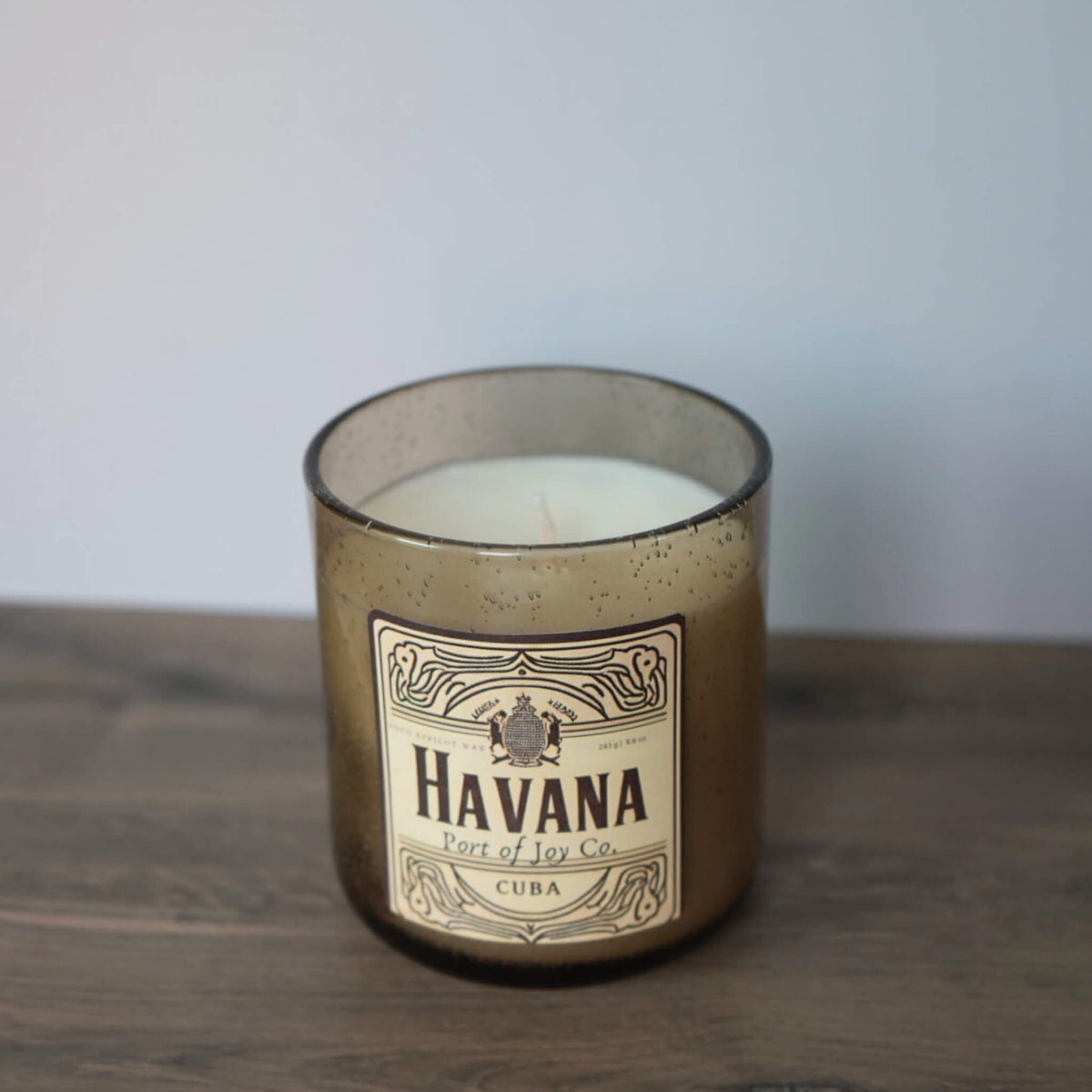 Handmade masculine scented candle featuring amber, sandalwood, and coastal-inspired notes.