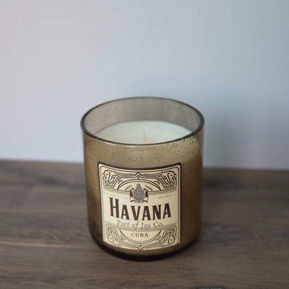 Handmade masculine scented candle featuring amber, sandalwood, and coastal-inspired notes.