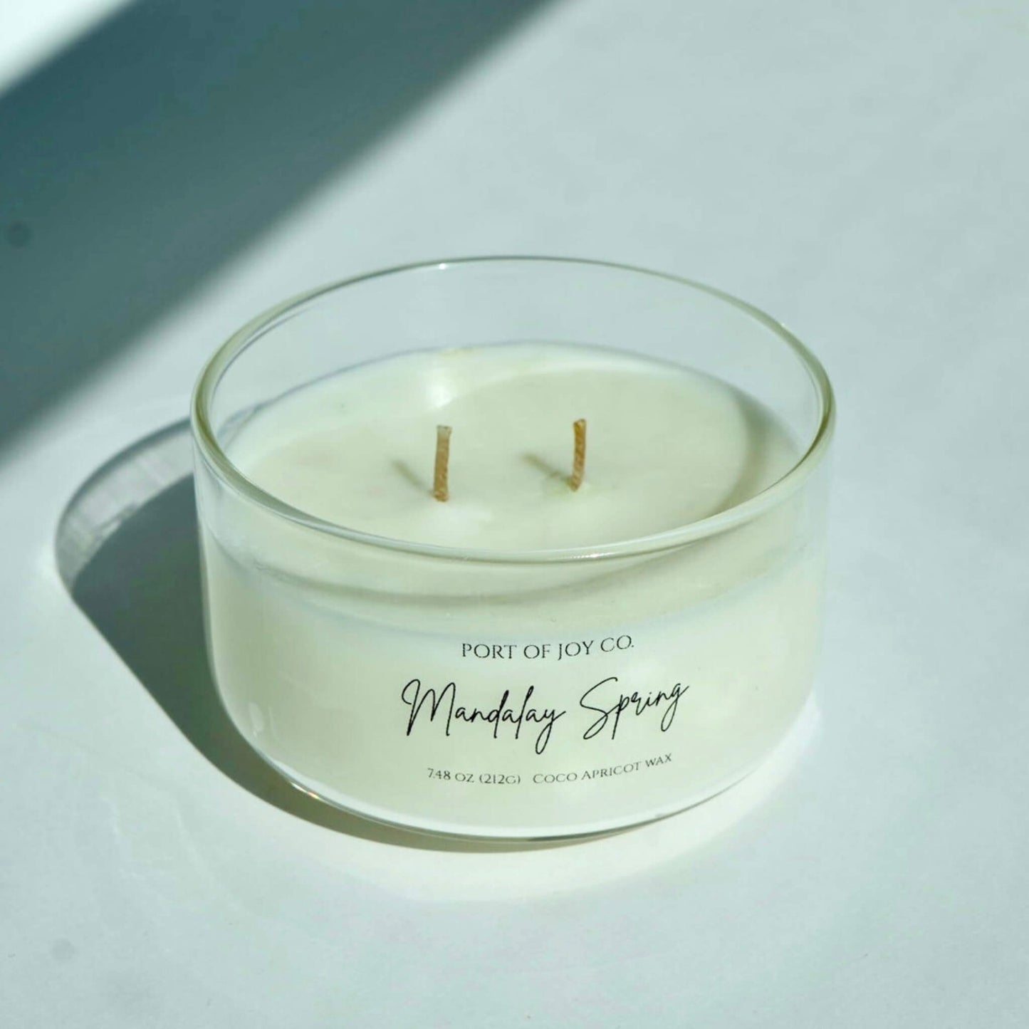 glass handmade candle labeled as mandalay springs