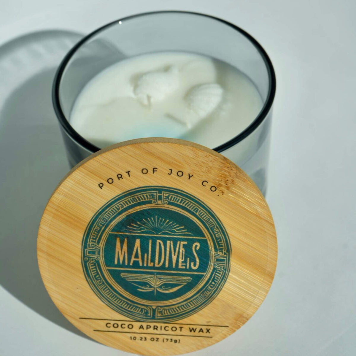 Luxury beach-inspired candle with sea salt, eucalyptus, sandalwood, and soft musk.