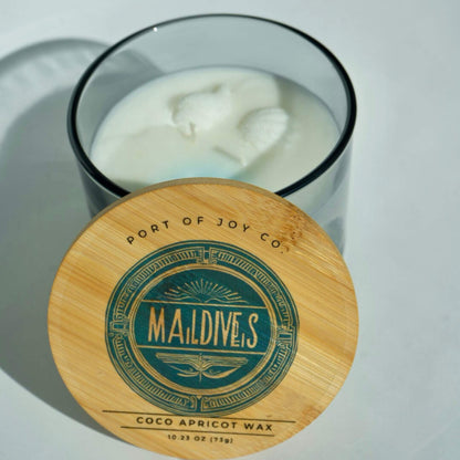 Luxury beach-inspired candle with sea salt, eucalyptus, sandalwood, and soft musk.
