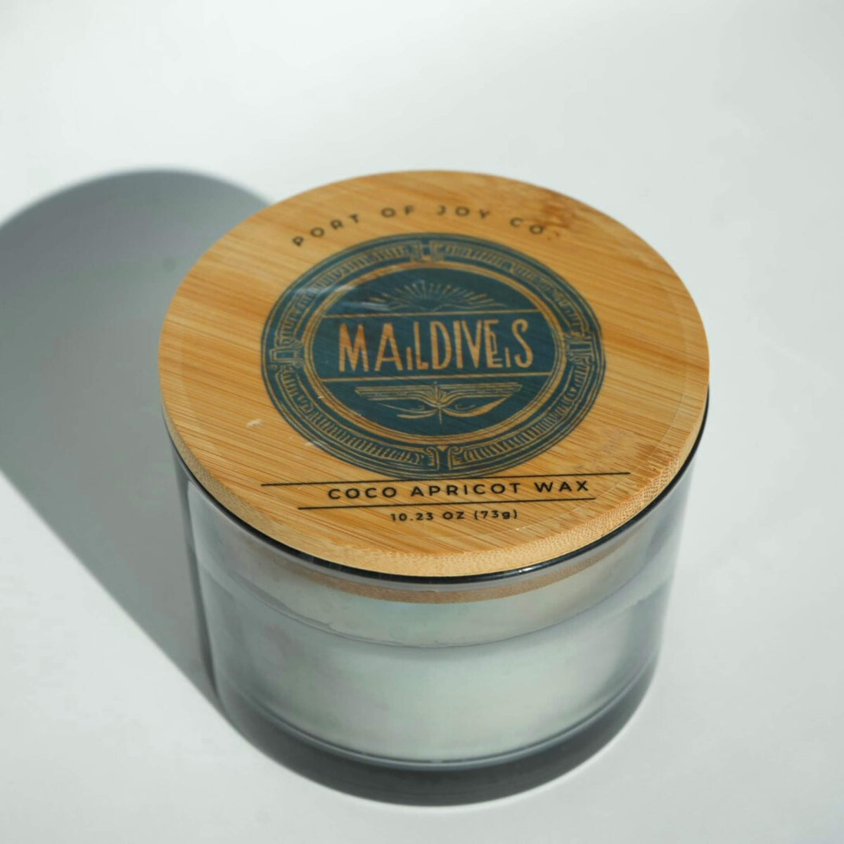 Handmade Fort Worth candle with a fresh aquatic fragrance and warm sandalwood notes.
