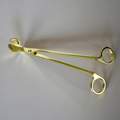 gold candle wick trimmer tool close up angled blade