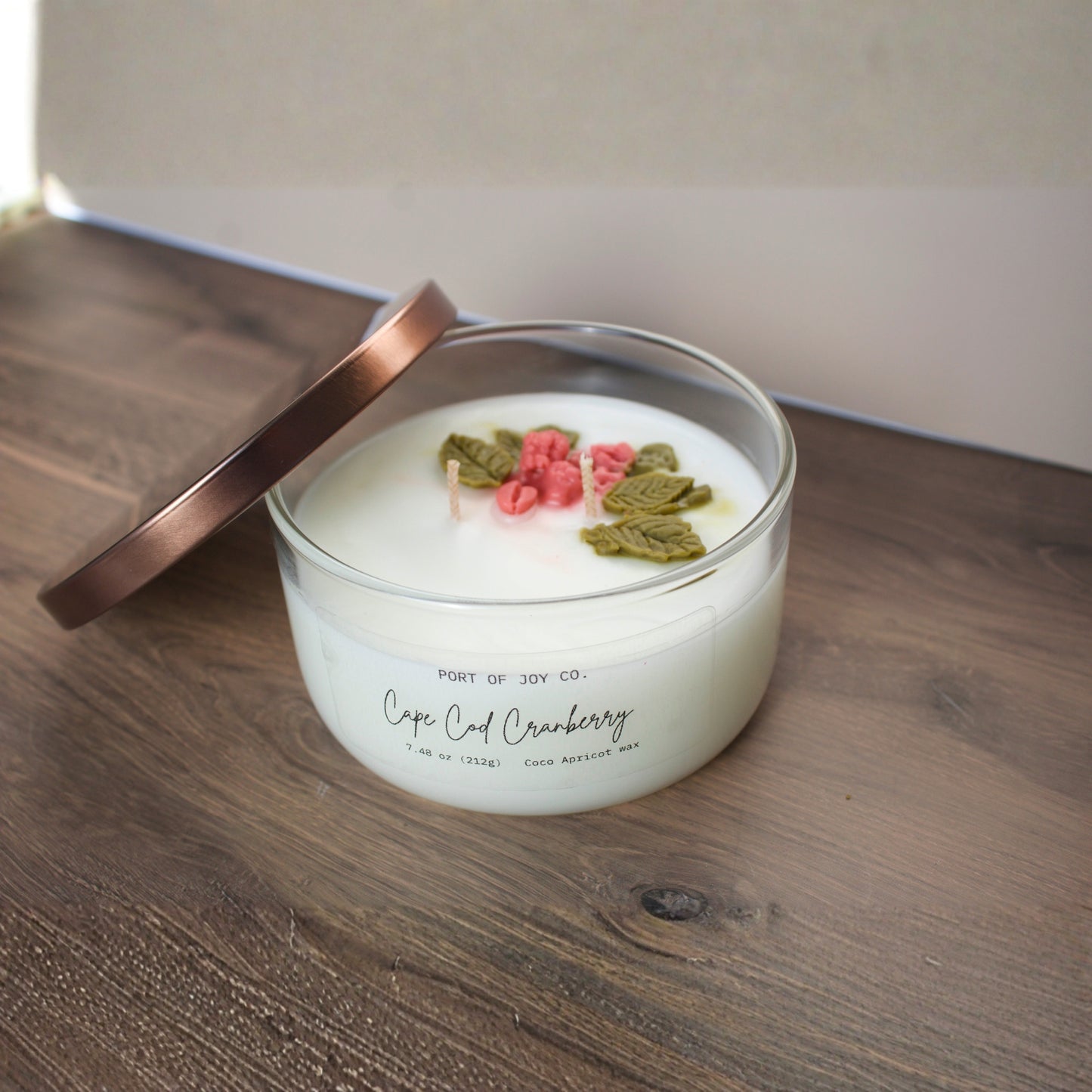 Hand-poured Cape Cod Cranberry candle in a clear glass jar with bronze lid, 7.5 oz holiday candle made with eco-friendly coco apricot wax, a perfect Christmas gift for 2025.