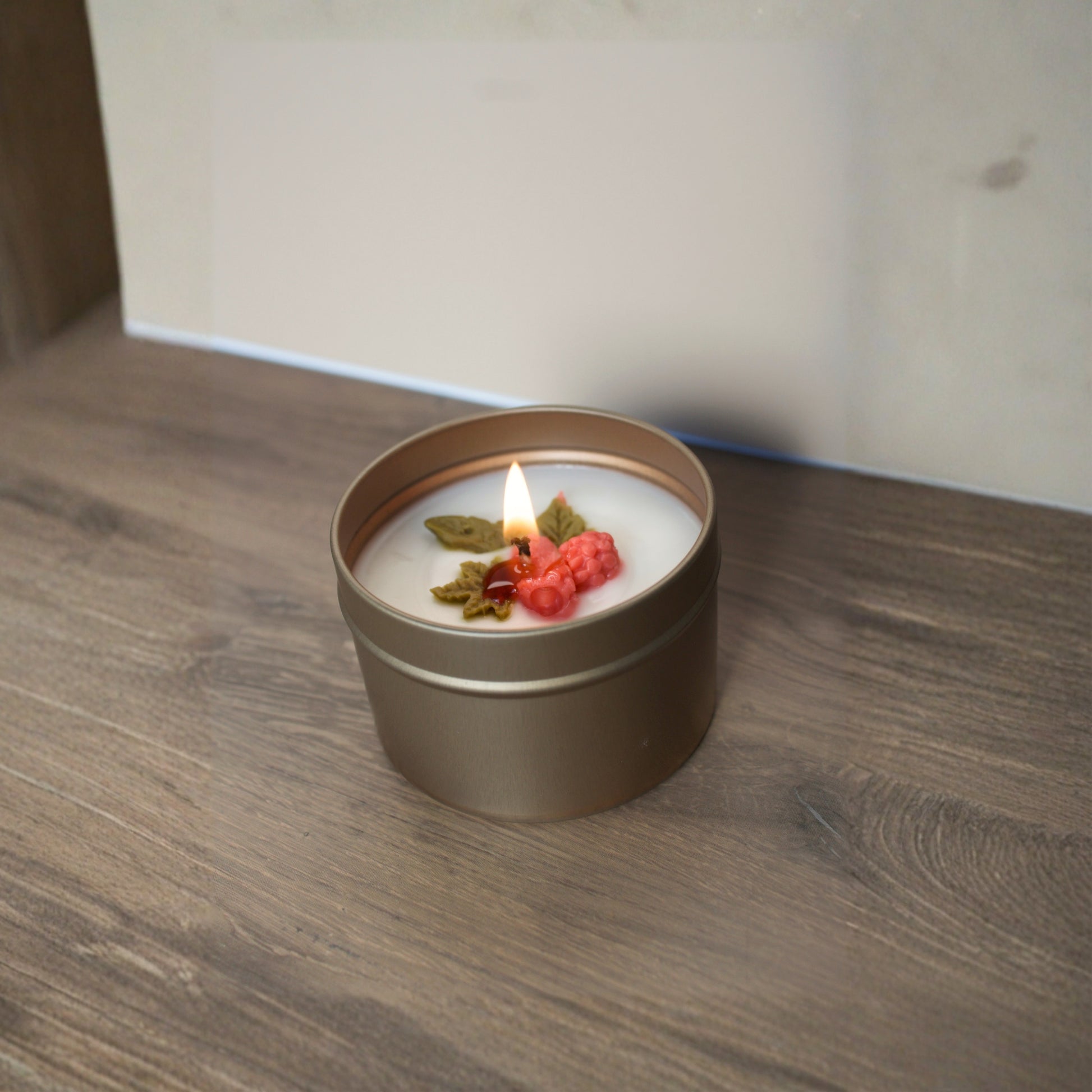 Light up Cape Cod Cranberry scented candle in a travel-size tin, hand-poured with a warm holiday fragrance. a minimalist, eco-friendly gift for family and friends in 2025.