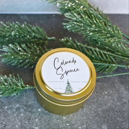 Port of Joy Colorado Spruce tin candle — a handmade 4 oz travel-size candle with notes of eucalyptus, spruce, moss, cedar, and amber, perfect for winter and holiday home decor.