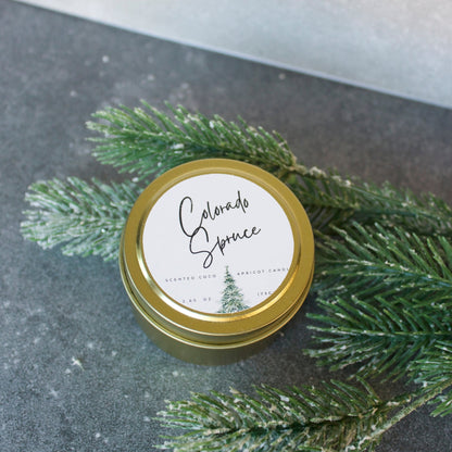 Port of Joy Colorado Spruce travel candle, a vegan, eco-friendly tin candle with fresh spruce, eucalyptus, cedar, and amber fragrance, perfect for holiday travel or gifting.