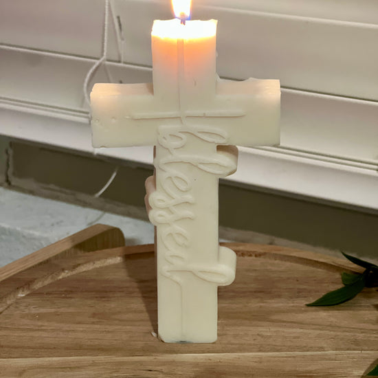 Video of handmade blessed cross soy candle showcasing details and design. Christian gift and religious decor.
