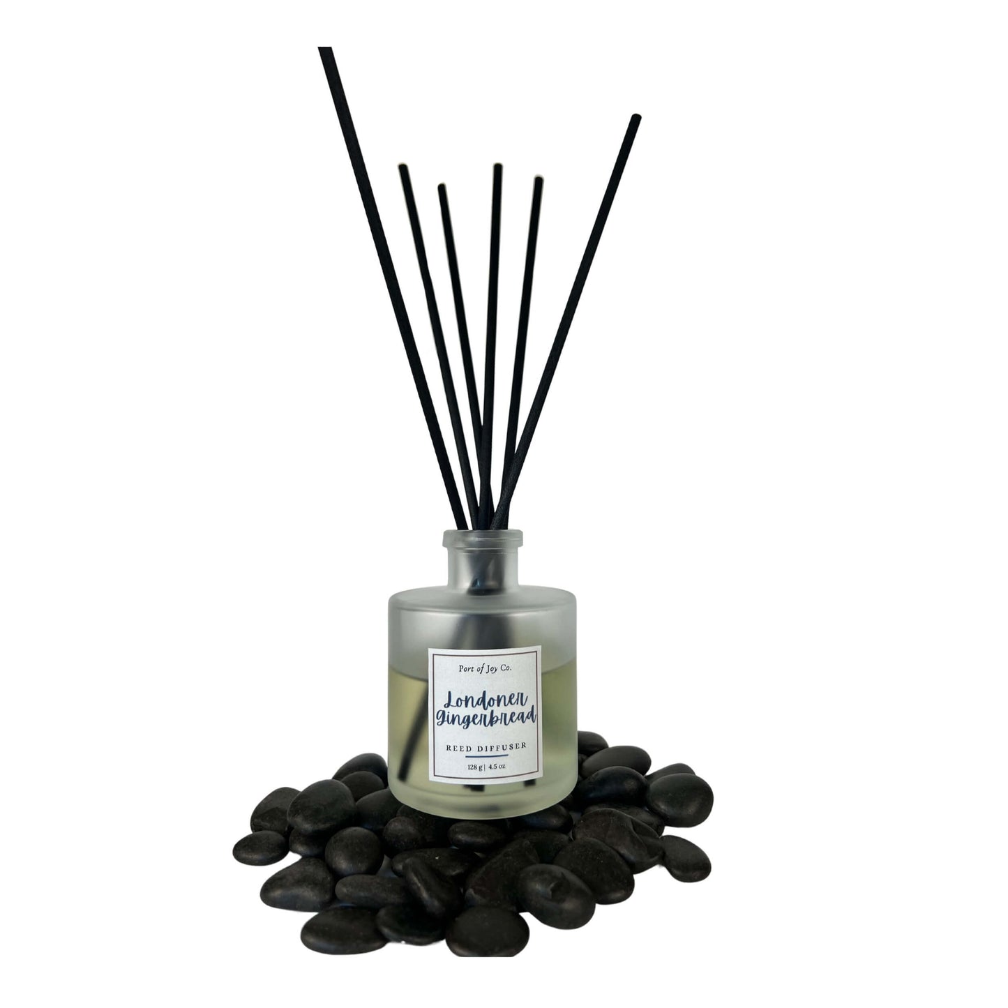 Reed diffuser with black sticks on a white background