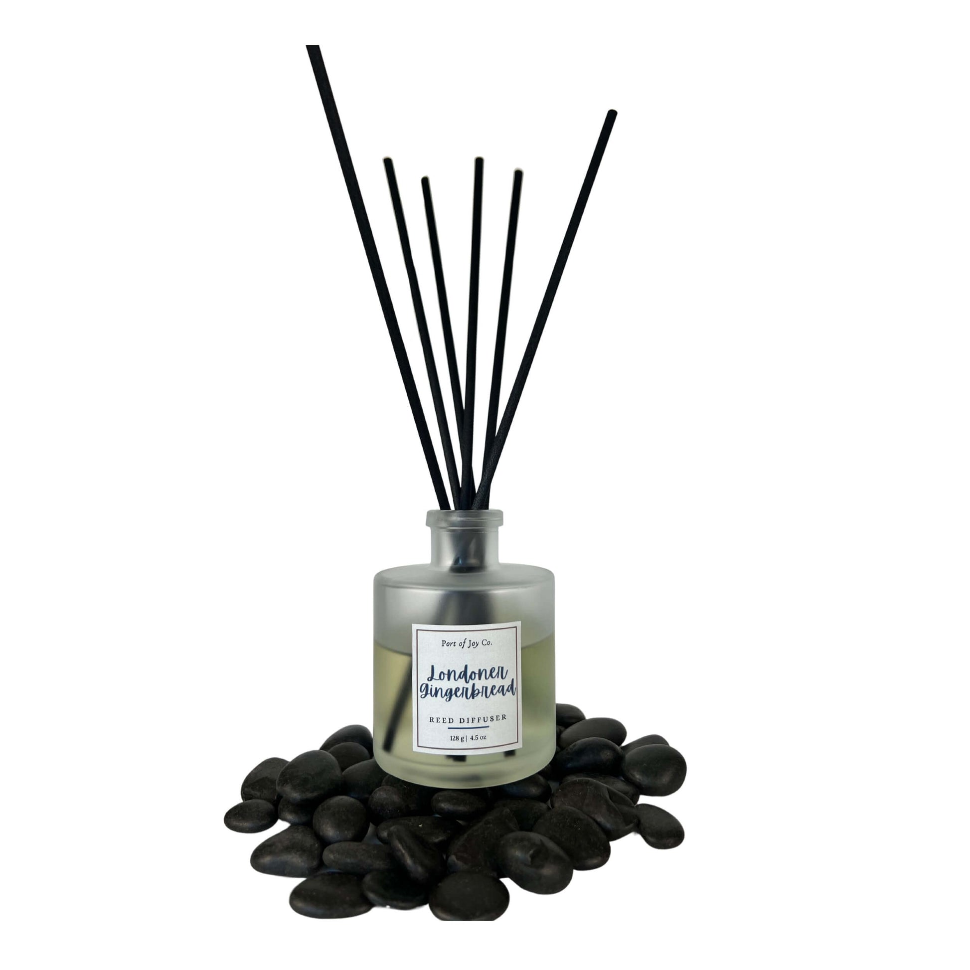 Reed diffuser with black sticks on a white background