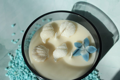 Luxury beach-inspired candle with sea salt, eucalyptus, sandalwood, and soft musk.