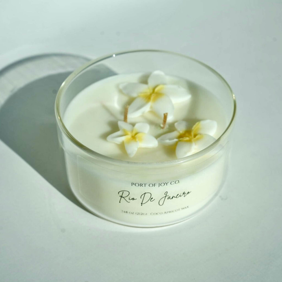 Handmade Rio de Janeiro inspired candle with tropical plumeria and creamy vanilla fragrance.