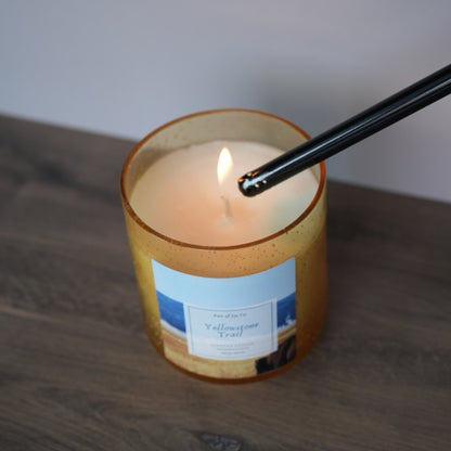 lighting up a candle labeled as yellowstone trail